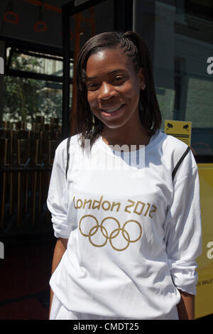Torchbearers run in the torch relay of the 19th Asian Games in Zhoushan
