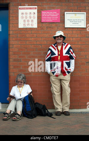 Manchester, UK. 26th July, 2012. Two Great Britain fans wait outside Old Trafford, Manchester United's ground, where the first Olympic Football matches at the ground were to be played later in the afternoon. Uruguay v United Arab Emirates was to be followed by Great Britain v Senegal, 26-07-2012 Stock Photo