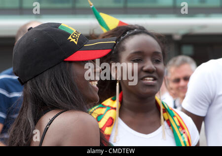 Manchester, UK. 26th July, 2012. Two Senegalese fans outside Old Trafford, Manchester United's ground, where the first Olympic Football matches at the ground will be played later in the afternoon. Uruguay v United Arab Emirates will be followed by Great Britain v Senegal, 26-07-2012 Stock Photo