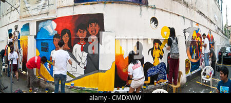 Filipino students paint murals depicting the Philippine Revolution as part of an art competition at the University of the Philippines in Manila, Philippines, 27 July, 2012. The Philippine Revolution occured in 1896 which resulted in the secession of the Philippine Islands from the Spanish Empire. Stock Photo