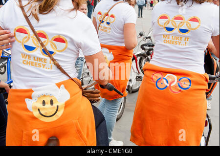 Trafalgar Square, London, UK, 27 July 2012. Dutch fans pass through Trafalgar Square having cycled to London from the ferry port.  They were concerned that their 'fun' supporters t-shirts and sweat shirts would be banned from the Olympic Park. Pic: Guy Bell/Alamy Live News Stock Photo