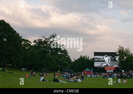 People watching the London Olympic opening ceremony on Europe's largest mobile screen in Gadebridge Park, Hemel Hempstead, England, UK. Stock Photo