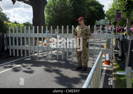 29th July 2012. Wimbledon London, UK.  Military personel manning a gate barrier outside the All England Lawn Tennis Croquet Club as part of security at the London 2012 Olympic games Stock Photo