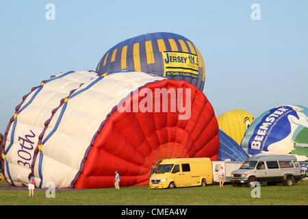 Hot air balloons being inflated at the 30th Annual Quik Check Festival of Ballooning at Thor Soldberg Airport in Readington, New Jersey on July 28, 2012. The festival is one of the largest in the United States. Stock Photo