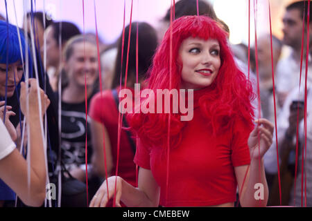 July 27, 2012 - London, UK - Czech Olympic House, officially opened by a Czech president Vaclav Klaus, takes over the Business Design Centre in Islington during the Games with 20 panoramic screens and a busy program to support Czech athletes. The center piece of the country's display is David Cerny's ''London booster', a full-size red London bus with robotic arms that performs push-ups, London, UK (Credit Image: © Veronika Lukasova/ZUMAPRESS.com) Stock Photo