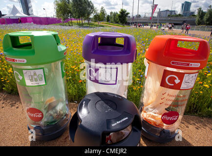 Corporate sponsorship, branding and retailing in the London 2012 Olympic Park - recycling bins with Coca-Cola branding Stock Photo