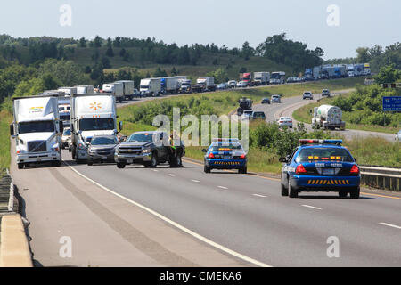 Monday, 30 July, 2012 -- Traffic backs up on Interstate 94 after a Sport Utility Vehicle crashed into the rear of a flatbed semi-trailer mile marker 6 in Hudson, Wisconsin, USA. At least one person died in the accident.