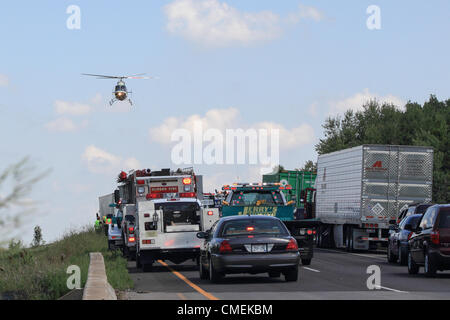 Monday, 30 July, 2012 -- A LifeFlight helicopter transports a victim from the scene of a deadly accident on Interstate 94 in Hudson, Wisconsin, USA. The accident occurred at about 1:30 Monday afternoon when a Sport Utility Vehicle with six passengers crashed into the rear of a flatbed semi-trailer. At least one person died in the accident. Stock Photo