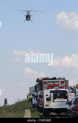 Monday, 30 July, 2012 -- A LifeFlight helicopter transports a victim from the scene of a deadly accident on Interstate 94 in Hudson, Wisconsin, USA. The accident occurred at about 1:30 Monday afternoon when a Sport Utility Vehicle with six passengers crashed into the rear of a flatbed semi-trailer. At least one person died in the accident. Stock Photo