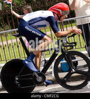 Bradley Wiggins manages a smile on his way to gold medal in the men's time trial. Here he is shown leaving Twickenham, West London, UK, during the closing stages of the race, on Wednesday August 1. London 2012 Olympic Games. 1st Aug 2012. UK Stock Photo