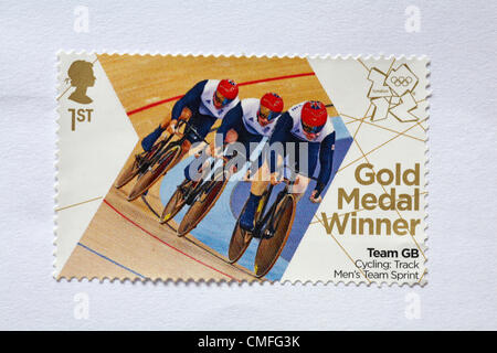 UK Friday 3 August 2012. Stamp to honour gold medal winner Team GB Cycling Track Men's Team Sprint event. - Sir Chris Hoy, Jason Kenny and Philip Hindes.  Stamp purchased and stuck on white to send to Olympic supporter. Stock Photo