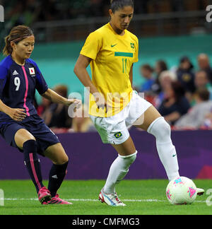 03.08.2012 Cardiff, Wales. Brazil Forward Cristiane (WFC Rossiyanka) and Japan Midfielder Nahomi Kawasumi (INAC Leonessa) in action during the Olympic Football Women's Quarter Final game between Brazil and Japan. The defensively solid Japanese side beat the skillful Brazilians 2-0 and progress to the Semi-Final of the Olympic Football tournament. Stock Photo