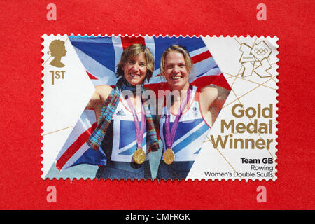 UK Saturday 4 August 2012. Stamp to honour gold medal winner Team GB Rowing Women's Double Sculls event. - Katherine Grainger and Anna Watkins. Stamp purchased and stuck on red envelope to send to Olympic supporter. Stock Photo