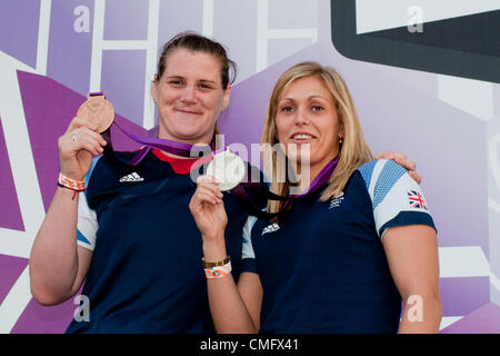 London, UK. Saturday 4th August 2012.  Olympic Judo bronze medalist Karina Bryant (left) and silver medalist Gemma Gibbons, show off their medals at BT London Live in Hyde Park. Stock Photo