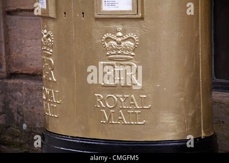 Sherborne, Dorset, UK Monday 6 August 2012. Royal mail gold painted post box at Sherborne, Dorset to recognise Olympic gold medalist Peter Wilson gold medal winner at Olympics London 2012 games. golden postbox  golden post box gold postbox gold post box gold mailbox golden mailbox gold letterbox golden letterbox gold mail box golden mail box. Stock Photo