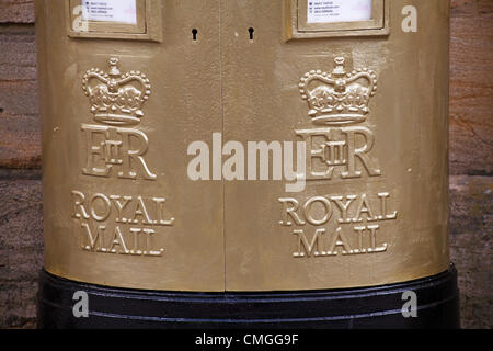 Sherborne, Dorset, UK Monday 6 August 2012. Royal mail gold painted post box at Sherborne, Dorset to recognise Olympic gold medalist Peter Wilson gold medal winner at Olympics London 2012 games. golden postbox  golden post box gold postbox gold post box gold mailbox golden mailbox gold letterbox golden letterbox gold mail box golden mail box. Stock Photo