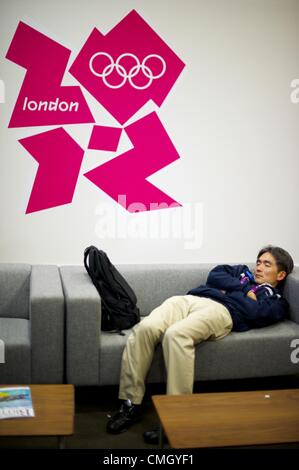Aug. 5, 2012 - London, England, United Kingdom - A member of the press slumbers in the media centre at 5:27 am during the 2012 London Summer Olympics. (Credit Image: © Mark Makela/ZUMAPRESS.com) Stock Photo