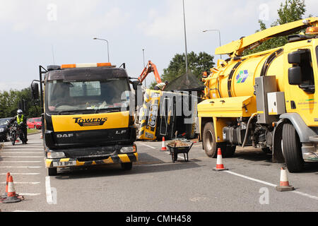 9th Aug 2012. A heavy truck owned by the Weston super Mare based Towens Recycling turned over while travelling on A4174 round the Wick roundabout near the Willy Wicket pub. It was carrying waste for recycling. Credit:  Timothy Large / Alamy Live News Stock Photo