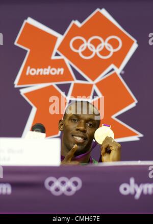 Aug. 9, 2012 - London, England, United Kingdom - Gold medal winner Jamaican sprinter USAIN BOLT participates in a press conference following his victory with teammates and silver and bronze recepients, Yohan Blake and Warren Weir, in Olympic Stadium, during the 2012 London Summer Olympics. (Credit Image: © Mark Makela/ZUMAPRESS.com) Stock Photo