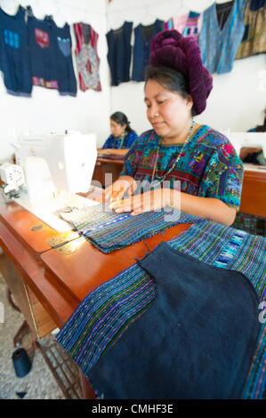 Aug. 2, 2012 - Santa Catarina Polopo (Municipal, Solola (Department, Guatemala - August 2, 2012, Solola, Guatemala - A Counterpart International beneficiary works at a sewing machine in a class supported by Counterpart through partner agency Grupos Gestores (Management Groups) in the town of Santa Catarina Palopo, Guatemala. Through the four-month long course, 25 local women are learning sewing skills they can use to make items for sale in this tourist town. (Credit Image: © David Snyder/ZUMAPRESS.com) Stock Photo