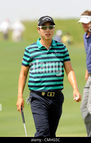 Sang-Moon Bae of South Korea reacts to his putt on the second green ...