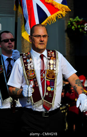 11 August 2012, Londonderry. Apprentice Boy of Derry wearing sash and carrying a sword during a loyalist parade. 10,000 Apprentice Boys of Derry and 120 bands took part in the annual Relief of Derry parade, the largest Loyal order parade held in Northern Ireland. Credit:  George Sweeney / Alamy Live News Stock Photo