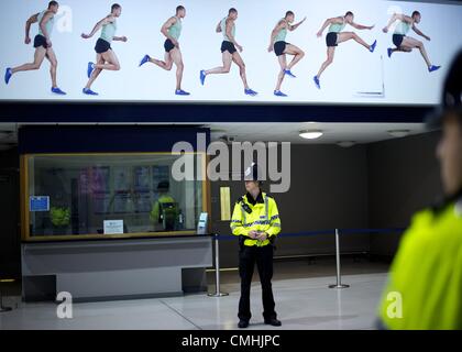 July 29, 2012 - London, England, United Kingdom - Police monitor activity late night at Stratford Station on the third day of the 2012 London Summer Olympics. (Credit Image: © Mark Makela/ZUMAPRESS.com) Stock Photo