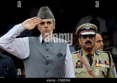 Aug. 15, 2012 - Srinagar, Kashmir, India - Kashmir's Chief Minister OMAR ABDULLAH ( L, in grey) inspects a parade during celebrations marking India's Independence Day at Bakshi Stadium in Srinagar, the summer capital of Indian Kashmir. A strike, sponsored by both hardline and moderate factions of the Kashmiri's main separatist alliance, cleared the streets of the summer capital Srinagar and shut all shops and businesses. (Credit Image: © Altaf Zargar/ZUMAPRESS.com) Stock Photo