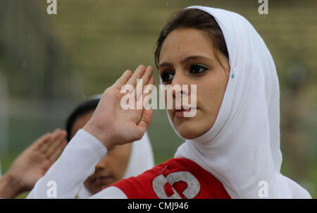 Aug. 15, 2012 - Srinagar, Kashmir, India - A Kashmiri Muslim school girl during celebrations marking India's Independence Day at Bakshi Stadium in Srinagar, the summer capital of Indian Kashmir. A strike, sponsored by both hardline and moderate factions of the Kashmiri's main separatist alliance, cleared the streets of the summer capital Srinagar and shut all shops and businesses. (Credit Image: © Altaf Zargar/ZUMAPRESS.com) Stock Photo