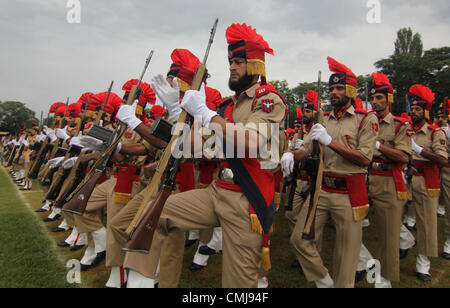 Aug. 15, 2012 - Srinagar, Kashmir, India - Indian police present arms during celebrations marking India's Independence Day at Bakshi Stadium in Srinagar, the summer capital of Indian Kashmir. A strike, sponsored by both hardline and moderate factions of the Kashmiri's main separatist alliance, cleared the streets of the summer capital Srinagar and shut all shops and businesses. (Credit Image: © Altaf Zargar/ZUMAPRESS.com) Stock Photo