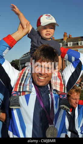 15th Aug 2012. Team GB Olympic sailors open top bus tour of Weymouth and Portland. Andrew Simpson and son Freddie.  PICTURE BY: DORSET MEDIA SERVICE Stock Photo