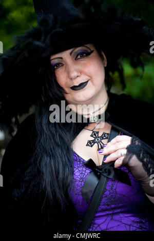 Lancashire, UK. Saturday, August 18th 2012.  Debbie Robinson holding Crucifix at the Big Witch Event Barley, in the borough of Pendle, in Lancashire, England.  Official Guinness World Record attempt at “the largest gathering of people dressed as witches, raising funds for Pendleside Hospice on the occasion of the 400th anniversary of the Pendle Witch Trials Stock Photo