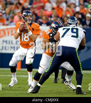 Aug. 18, 2012 - Denver, CO, USA - Broncos QB PEYTON MANNING, left, readies to throw a pass during the 1st. half at Sports Authority Field at Mile High Saturday night. The Seahawks beat the Broncos 30-10. (Credit Image: © Hector Acevedo/ZUMAPRESS.com) Stock Photo