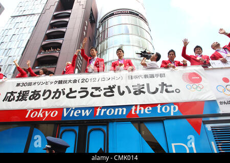 August 20, 2012, Tokyo, Japan - Japanese Olympic medalists wave during a parade in the Ginza district of Tokyo as they greeted their loyal fans on Monday, August 20, 2012. Over 100,000 people filled the streets of Tokyo's Ginza district to honor Japan's returning medalists from the London Olympics. The Japan team won a total of 38 medals in London, the most ever by a Japan team. (Photo by Nate Jordan/AFLO) Stock Photo