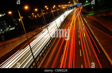 Berlin, Germany. 31st Oct, 2013. Vehicles are driven at night on the Autobahn 100 in Berlin, Germany, 31 October 2013. Photo: Paul Zinken/dpa/Alamy Live News Stock Photo