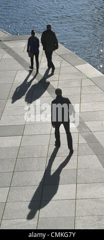 Berlin, Germany. 31st Oct, 2013. People walk along the banks of the Spree river in the government district in Berlin, Germany, 31 October 2013. Photo: Paul Zinken/dpa/Alamy Live News Stock Photo