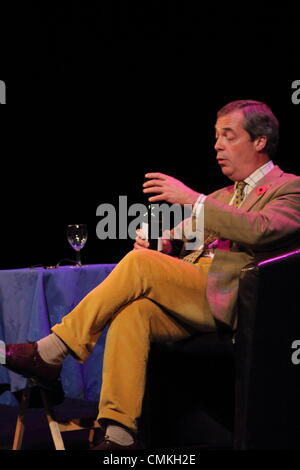 UKIP party leader, Nigel Farage MEP drinks red wine on stage at Buxton Opera House during his UK Theatre Tour, Derbyshire, UK Stock Photo