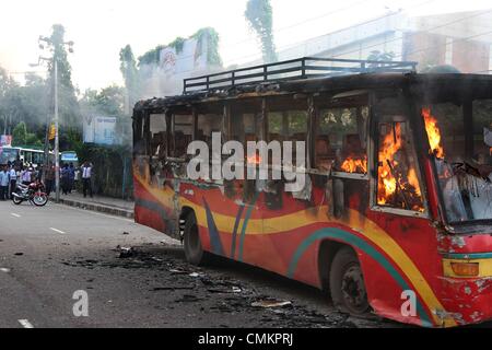 Dhaka. Bangladesh. 3rd Nov, 2013. A bus set on fire by Bangladeshi demonstrators burns on a street during a protest ahead of a three-day strike, in the capital Dhaka on November 3, 2013. The chief opposition Bangladesh Nationalist Party (BNP) is calling a three-day strike from November 4, ahead of the January 2014 parliamentary elections. Stock Photo