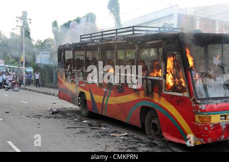 Dhaka. Bangladesh. 3rd Nov, 2013. A bus set on fire by Bangladeshi demonstrators burns on a street during a protest ahead of a three-day strike, in the capital Dhaka on November 3, 2013. The chief opposition Bangladesh Nationalist Party (BNP) is calling a three-day strike from November 4, ahead of the January 2014 parliamentary elections. Stock Photo