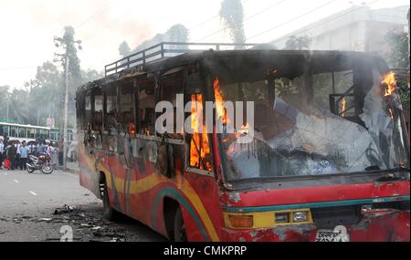 Dhaka. Bangladesh. 3rd Nov, 2013. A bus set on fire by Bangladeshi demonstrators burns on a street during a protest ahead of a three-day strike, in the capital Dhaka on November 3, 2013. The chief opposition Bangladesh Nationalist Party (BNP) is calling a three-day strike from November 4, ahead of the January 2014 parliamentary elections. Stock Photo