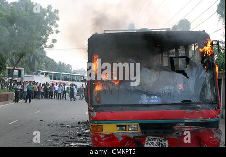 Dhaka. Bangladesh. 3rd Nov, 2013. A bus set on fire by Bangladeshi demonstrators burns on a street during a protest ahead of a three-day strike, in the capital Dhaka on November 3, 2013. The chief opposition Bangladesh Nationalist Party (BNP) is calling a three-day strike from November 4, ahead of the January 2014 parliamentary elections. Stock Photo