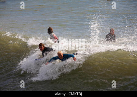 Bournemouth, Dorset UK. 3rd Nov, 2013. Surfers surfer making the most of the windy and stormy weather to enjoy the surf and waves at Bournemouth beach.  Credit:  Carolyn Jenkins/Alamy Live News Stock Photo