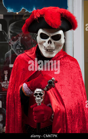 Whitby, Yorkshire, UK 2nd October, 2013.  Mr Mike Kershaw, wearing red cloak and hat.  from Sheffield in Phantom of The Opera Mask at the UK'S Biggest Goth & Alternative Weekend. Whitby. Goths, romantics and macabre fans travelled over the moors for the Whitby Goth Weekend, which has become their spiritual home. As well as Goths, there are Punks, Steampunks, Emos, Bikers, Metallers and all manner of weird and wonderful characters, Stock Photo