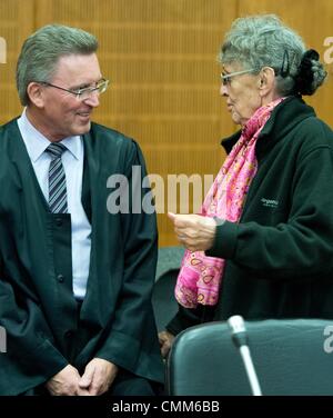 Frankfurt Main, Germany. 05th Nov, 2013. Accused Sonja Suder talks to her lawyer in the high security court room of the district court in Frankfurt Main, Germany, 05 November 2013. Suder stands accused of a possible involvement in a terror attack on the OPEC headquarters in Vienna in 1975. Photo: BORIS ROESSLER/dpa/Alamy Live News Stock Photo