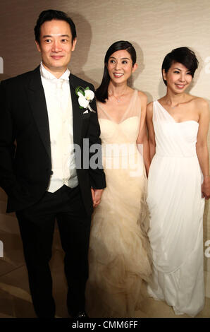 Charlie Yeung,husband Qiu Shaozhi and bridesmaid Valen Hsu pose for camera at their wedding ceremony in Singapore on Saturday November 2,2013. Stock Photo