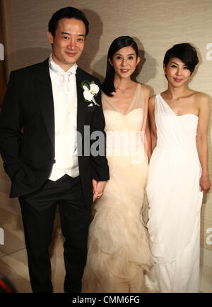 Charlie Yeung,husband Qiu Shaozhi and bridesmaid Valen Hsu pose for camera at their wedding ceremony in Singapore on Saturday November 2,2013. Stock Photo