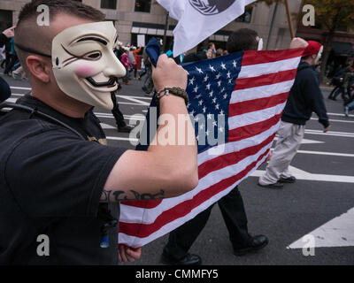 Washington, DC, USA. 05th Nov, 2013. Masked supporters of "Anonymous" marched from the White House to the U.S. capitol on Tuesday. They are seeking more transparency and less intrusion on privacy from the government and military. Credit:  Ann Little/17�Թ����� Live News Stock Photo