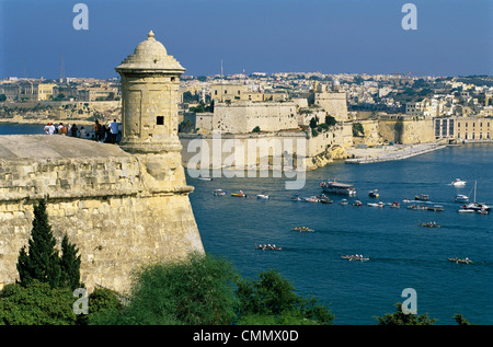 View over Bastions and Grand Harbour to Fort St. Angelo with Rowing Regatta, Valletta, Malta, Mediterranean, Europe Stock Photo