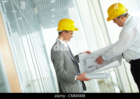 Two architects discussing new project at meeting Stock Photo