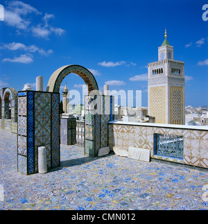 View over city and Great Mosque from tiled roof top, Tunis, Tunisia, North Africa, Africa Stock Photo